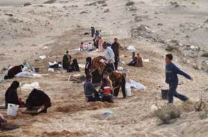 picking pebbles to survive in Gaza Yousef, 14, leads two of his younger brothers in their daily hunt for concrete materials off the highway between Khan Younis and Deir al-Balah.