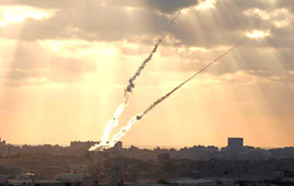 Image taken by Israel-Smoke rises over Gaza homes after launching of rockets against Israel (Photo Amir Meir) Optical illusion