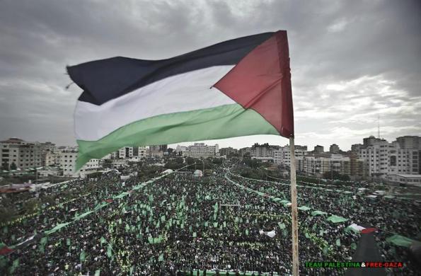 Palestinians attend the 25th anniversary of the creation of Hamas