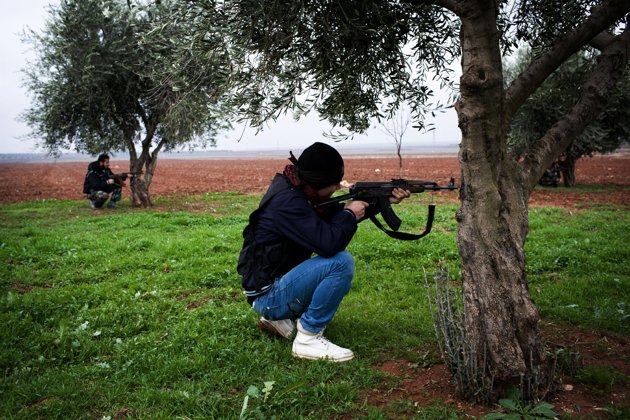 Associated Press/Manu Brabo - Free Syrian Army fighters aim their weapons, close to a military base, near Azaz, Syria, Monday, Dec. 10, 2012. The gains by rebel forces came as the European Union denounced the Syrian conflict, which activists say has killed more than 40,000 people. (AP Photo/Manu Brabo)