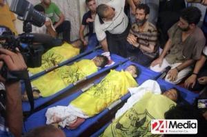 The bodies of the four children Mohammed Baker, 9-year-old; Ahed Baker, 10-year-old; Zakaria Baker, 10year-old; and Mohammed Baker, 11-year-old, are seen here being mourn by his male relatives.