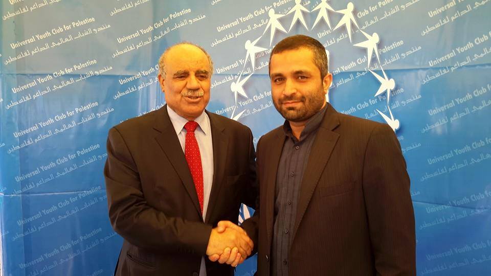 Palestinian ambassador to Tunis, Salman Al Harfi greets Reza Barekati, the Iranian representative for  Universal Youth Club for Palestine greets Palestinian at Al Manar University during the World Social Forum 2015