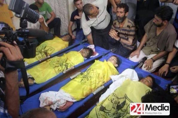 The bodies of the four children Mohammed Baker, 9-year-old; Ahed Baker, 10-year-old; Zakaria Baker, 10year-old; and Mohammed Baker, 11-year-old, are seen here being mourn by his male relatives.